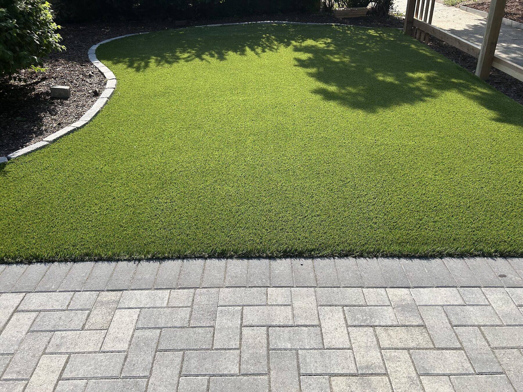 Artificial turf lawn with paver patio