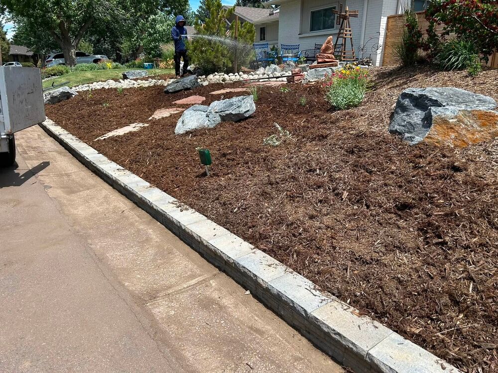 Mulch bed with boulder placements