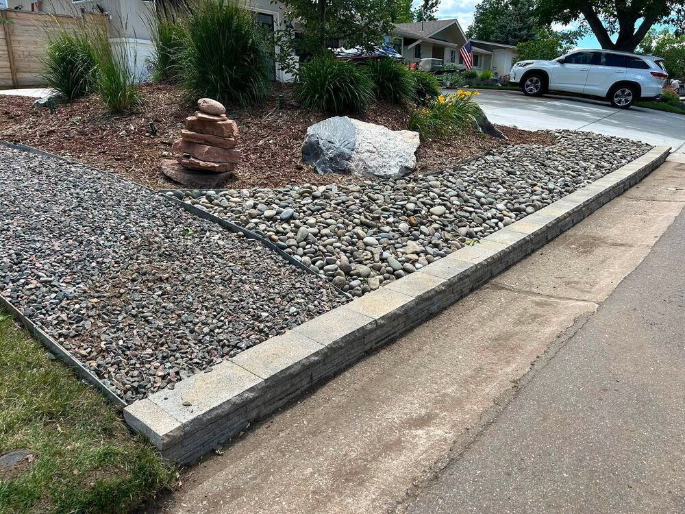 River rock beds with stone retaining border